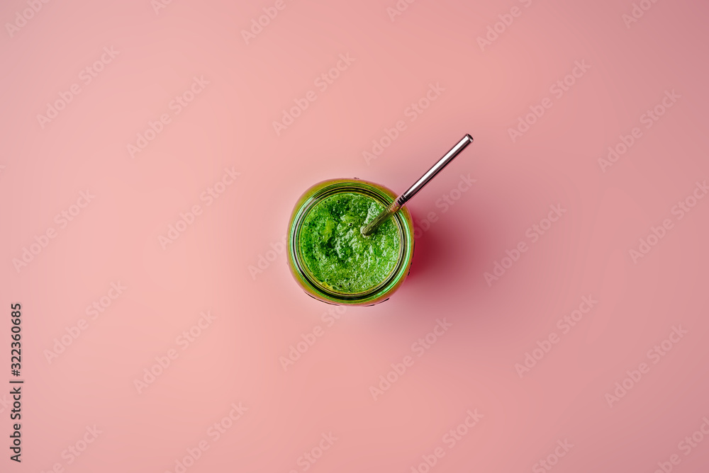 Cucumber vegan smoothie in a glass jar, nutrient hydrating green juice, detox food, weight loss concept, pink background, top view ,metal straw,zero waste ,copy space Cucumber vegan smoothie in a glass jar, nutrient hydrating green juice, detox food, weight loss concept, pink background, top view ,metal straw,zero waste ,copy space
