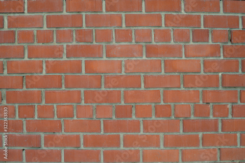 The texture of the brickwork of red brick. Structure, part of the wall.