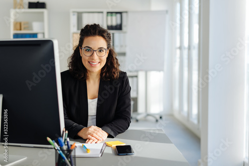 Young businesswoman sitting in an office photo