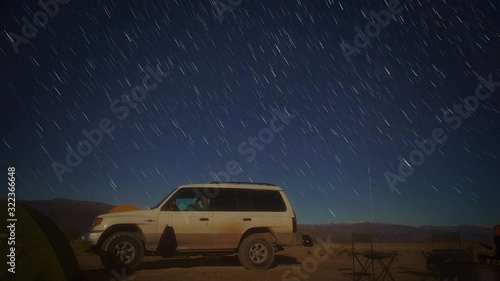 Car in the Desert with Stars Moving
