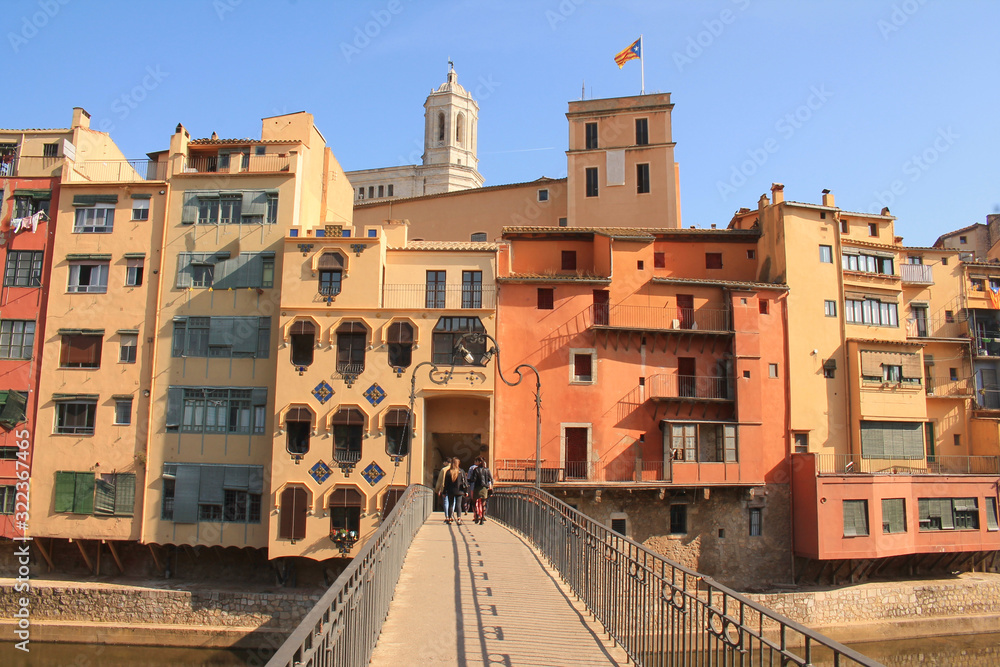 The amazing colorful houses along the river Onyar and the Cathedral of Saint Mary in the gorgeous city of Girona, Catalonia, Spain.