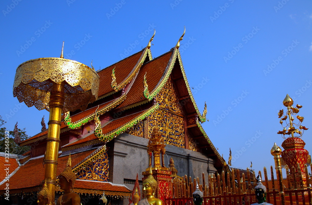 Fototapeta premium Beautifully decorated facade of Wat Phrathat Doi Southep in Chiangmai Thailand with many Buddha Statues
