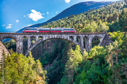 VERMA NORWAY - 2018 AUGUST 01. Train on the top one of Norway's most famous railway bridges named Kylling bridge.