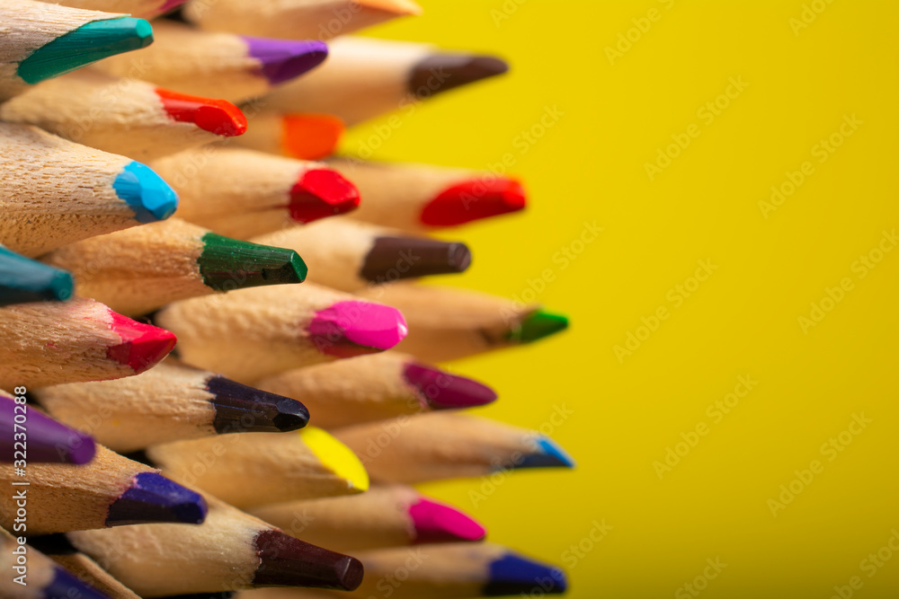 colored pencils on a white yellow background colored pencils on a white yellow background