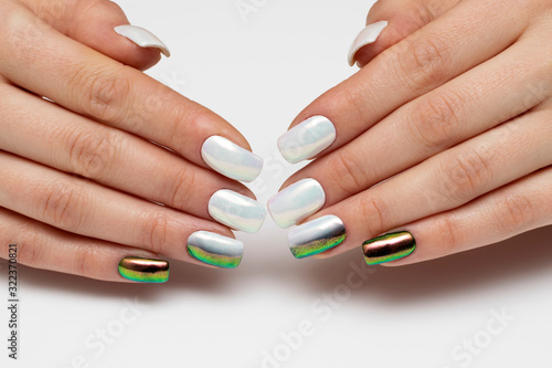 Holiday manicure. White rub on square nails closeup. Black and green manicure. Black and white оmbre