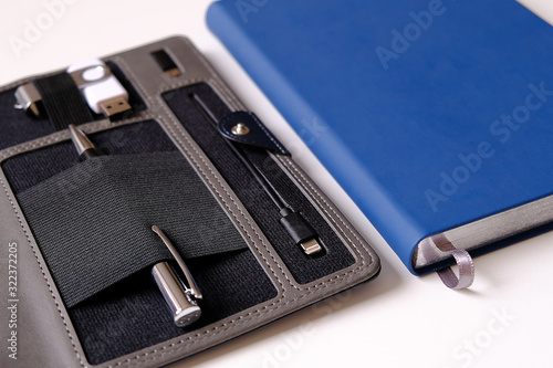 Organizer for business. Selective focus. Handle, battery charger for flash cards.