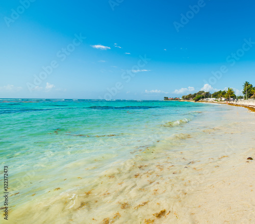 Turquoise sea and blue sky in Raisins Clairs beach in Guadeloupe
