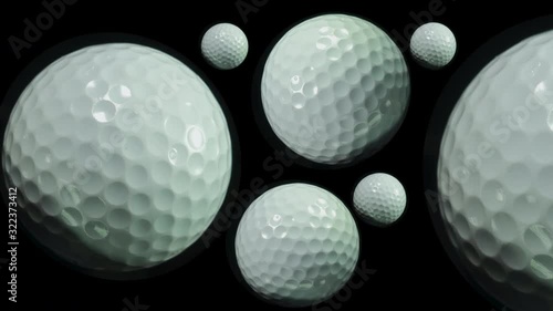 Golf. Ball games and sport. Many spinning golf balls close up.