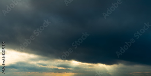 Fantastic dark thunderclouds at sunrise © StepStock