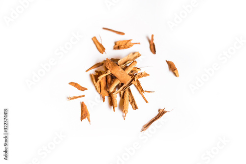 Closeup of a pile of organic cinnamon sticks isolated on a white background