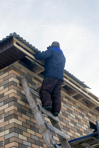 Wallpaper Mural man stands on the stairs at a construction site Torontodigital.ca