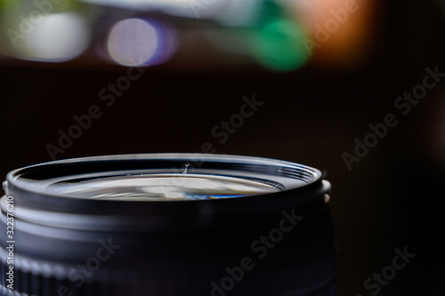 Dust on open camera lens glass
