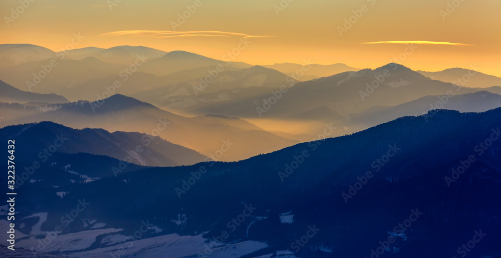 evening landscape in mountains with sunset light in mountain valley