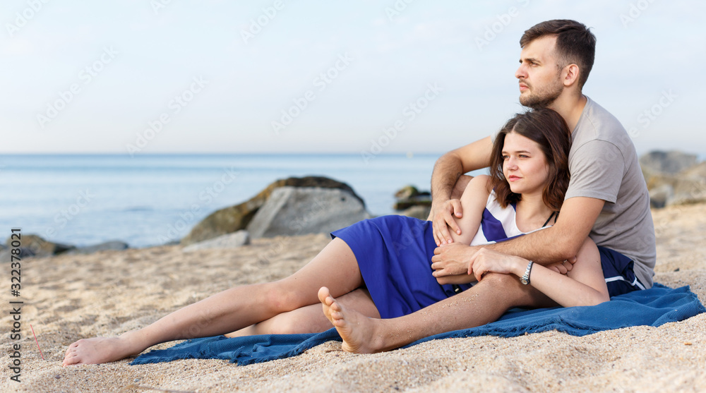 Fototapeta premium Young loving couple resting and hugging