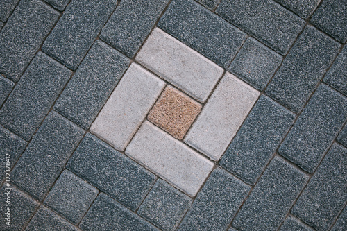 Brick stone tiled street pavement road texture background.