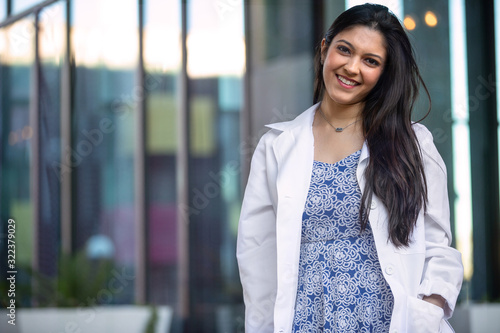 Canvastavla Beautiful smiling portrait of Indian American woman, medical practitioner, denta
