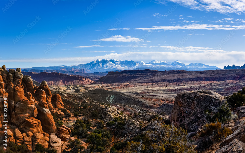 Sunset on the desert at Arches National Park and La Sal Mountains in the background