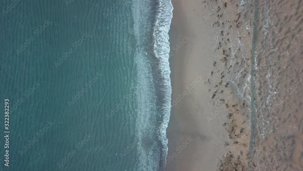 Aerial birds eye view looking down at sea waves crashing down. Green and blue sea top view drone, drone footage , 4k Aerial birds eye view looking down at sea waves crashing down. Green and blue sea top view drone, drone footage , 4k
