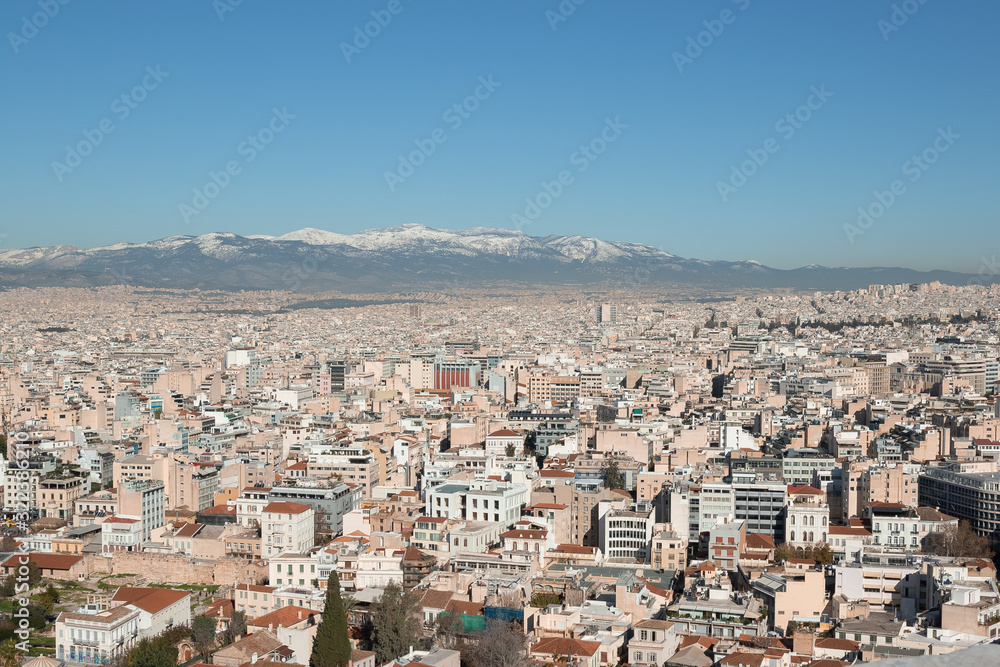 panoramic view of Athens, sea and mountains from the Acropolis hill in the morning haze