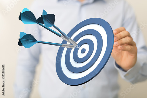 Fotografie dart target arrow hitting on bullseye which is the ultimate goal that everyone wants