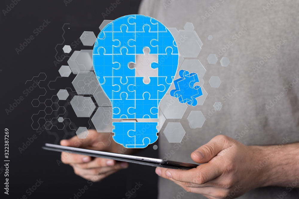  holding illuminated light bulb, idea, innovation and inspiration concept.