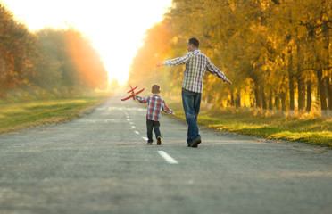 father and son walk in nature