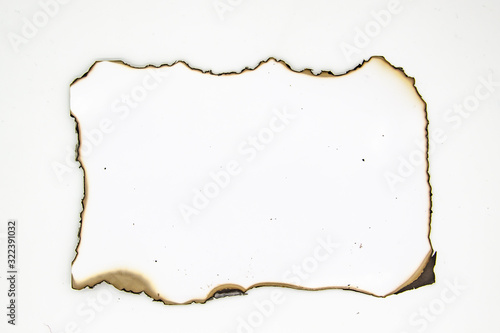 Burned photo paper on white background. Paper element can be used in design