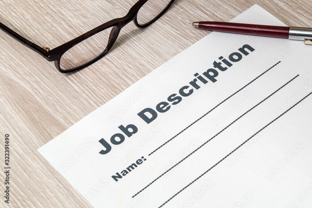 Job description form for filling with pen and glasses on table Job description form for filling with pen and glasses on table