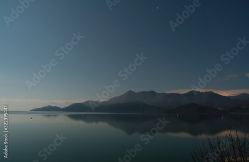 Skadar lake with mountain range at night long exposure