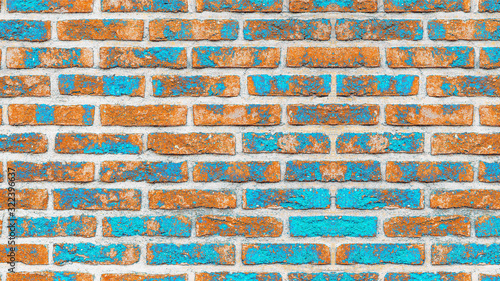 Orange blue abstract painted rustic brick wall texture background photo