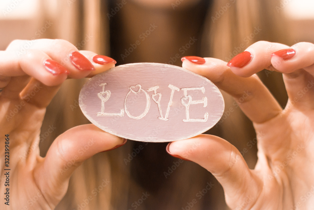 The word love. Romantic relationship. Tender feelings. Valentine's Day. Symbol of love. Date with a loved one. Happy girl. Engagement of two people. The word love. Romantic relationship. Tender feelings. Valentine's Day. Symbol of love. Date with a loved one. Happy girl. Engagement of two people.