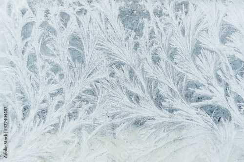 Frosty pattern on the window, similar to the branches of trees.