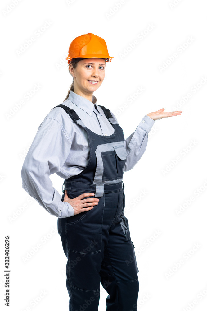 Girl builder shows a gesture of his hand to the side. Isolated Girl builder shows a gesture of his hand to the side. Isolated