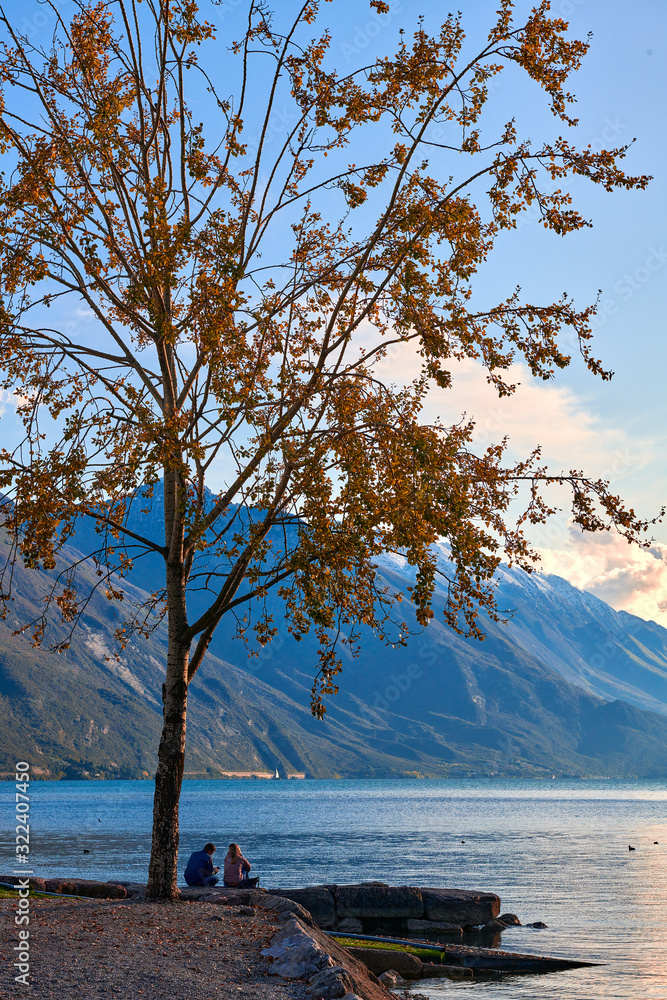 Beautiful and colorful autumn in Riva del Garda, Garda lake surrounded by mountains, Trentino Alto Adige region, Lago di garda, italy Beautiful and colorful autumn in Riva del Garda, Garda lake surrounded by mountains, Trentino Alto Adige region, Lago di garda, italy