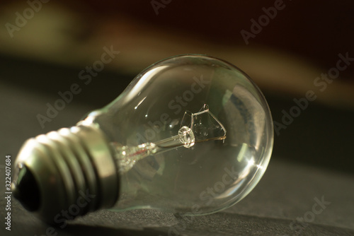 new light bulb on black background close-up