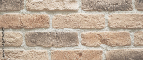 Orange brick wall, abstract background texture. Banner.