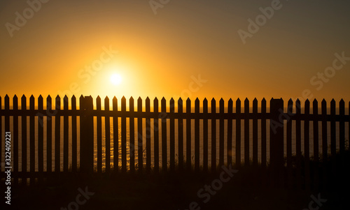 Silhouette of a fence at sunrise, Sydney Australia