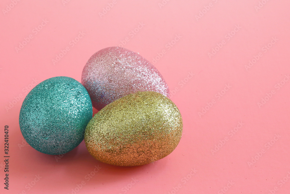 Easter eggs on the pink background. Holiday spring background. Easter eggs on the pink background. Holiday spring background.