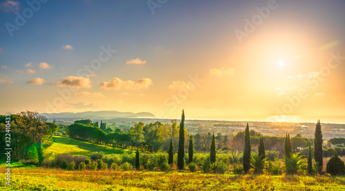 Maremma sunset panorama. Countryside, sea and Elba on horizon. San Vincenzo, Tuscany, Italy. photo