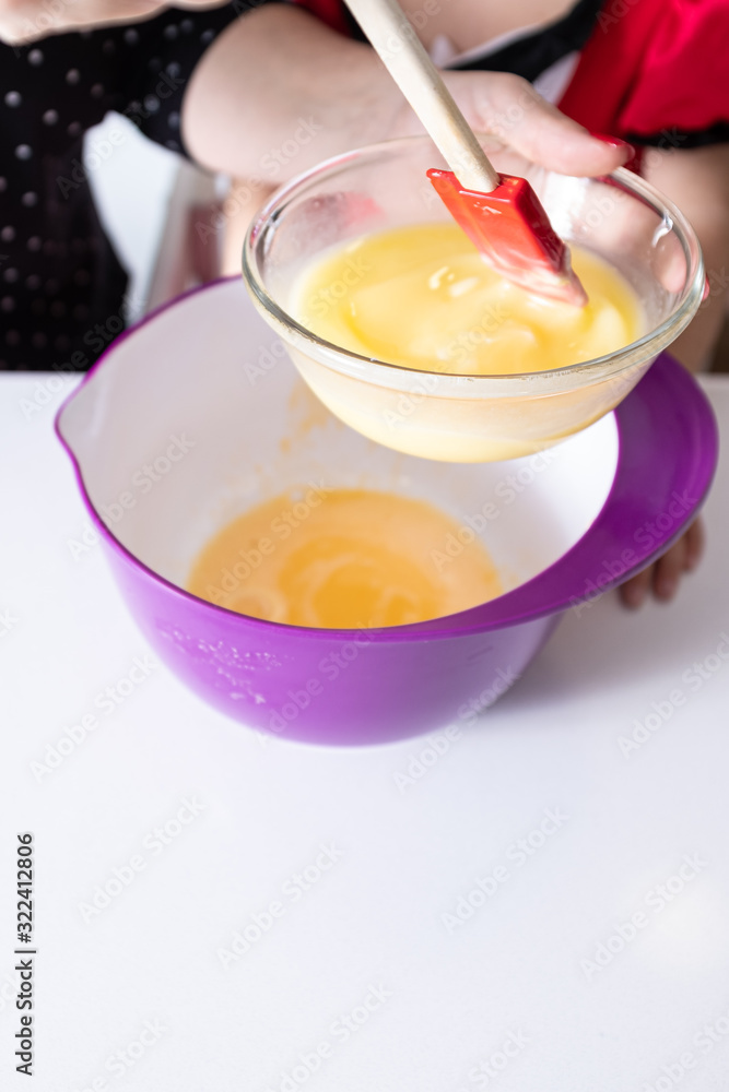Mixing yellow egg sauce on a domestic kitchen Mixing yellow egg sauce on a domestic kitchen