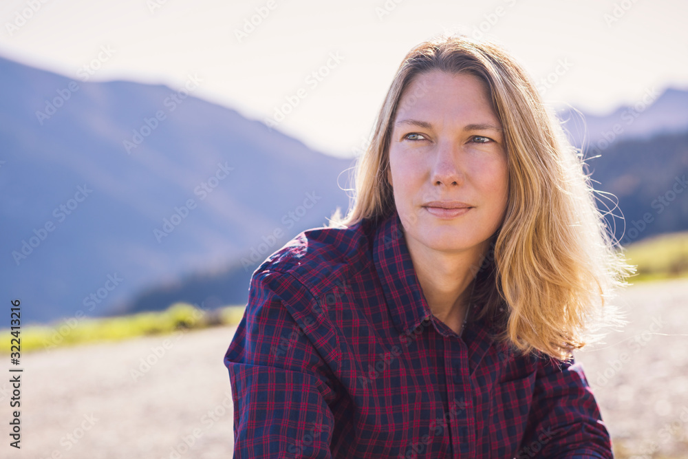 Portrait of woman in front of mountains Portrait of woman in front of mountains