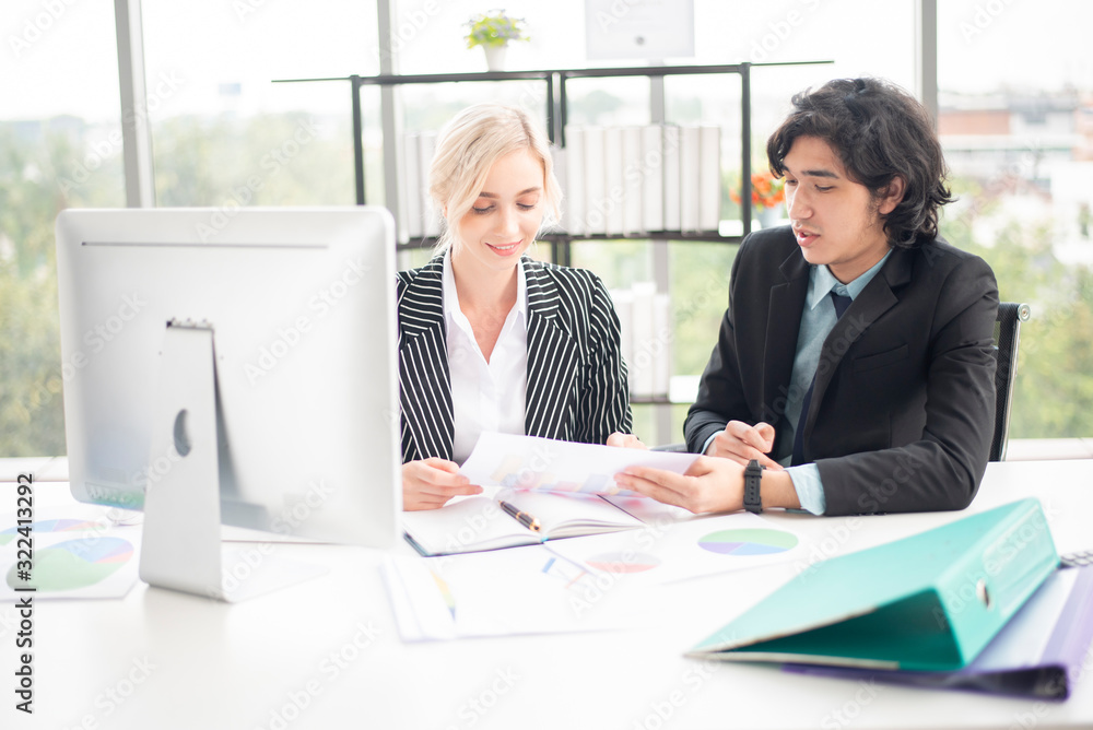 Business people are analyzing financial report Business people are analyzing financial report