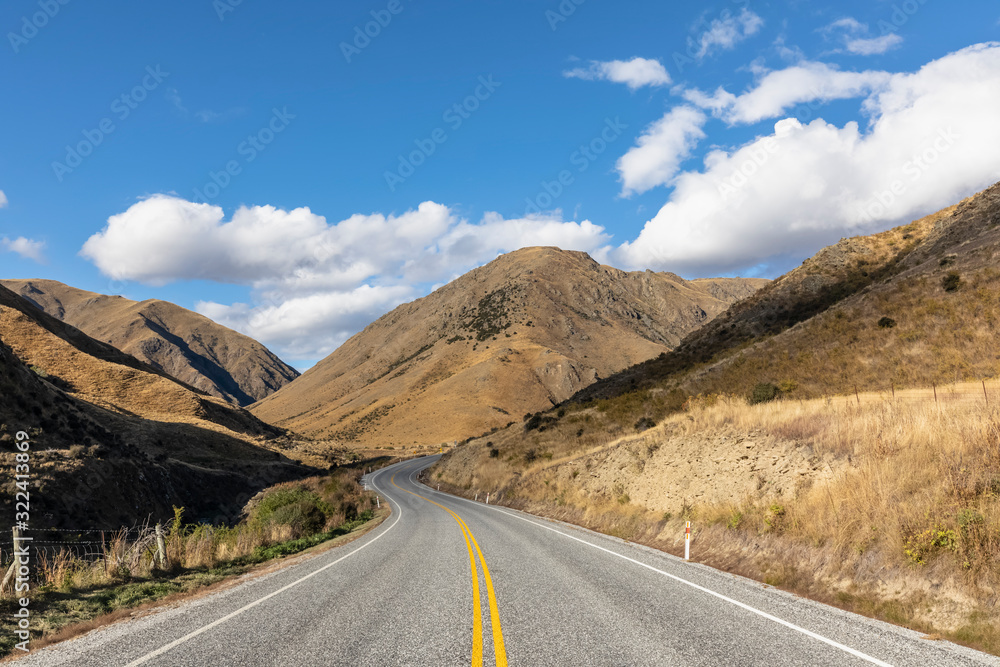 New Zealand, Clouds over empty State Highway 8 in Lindis Pass New Zealand, Clouds over empty State Highway 8 in Lindis Pass