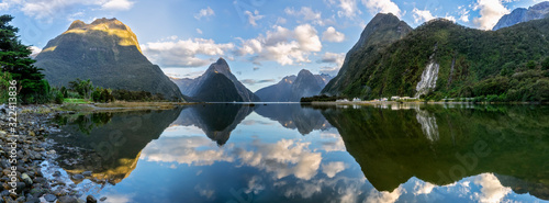 New Zealand, Scenic panorama of mountains reflecting on shiny surface of Milford Sound photo