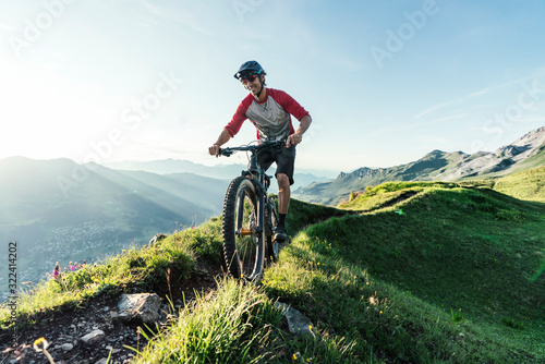 Mountain biker on a way in Grisons, Switzerland