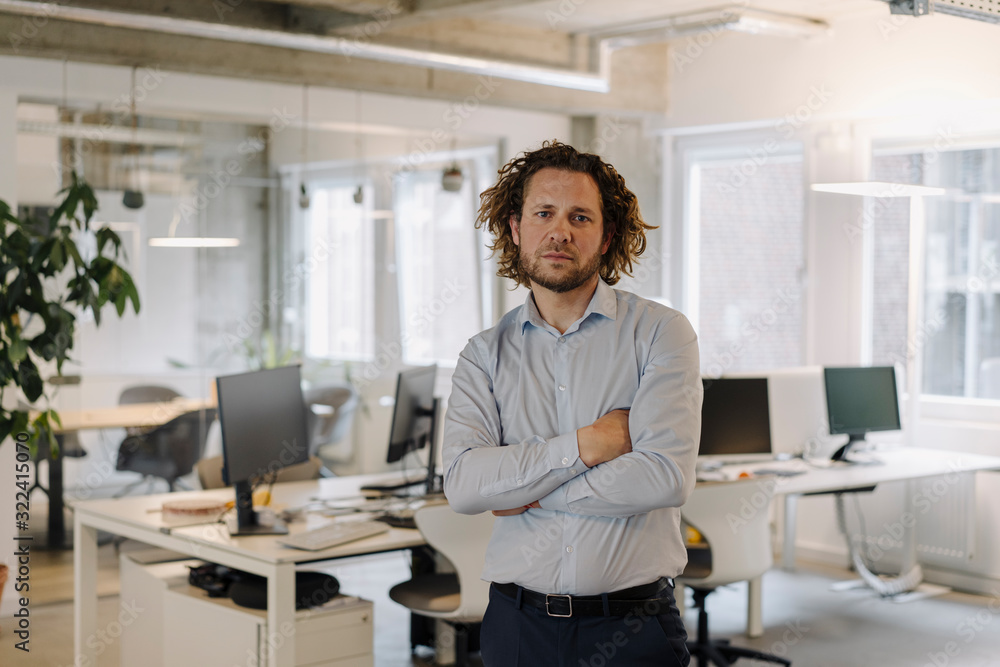 Portrait of confident businessman in office Portrait of confident businessman in office