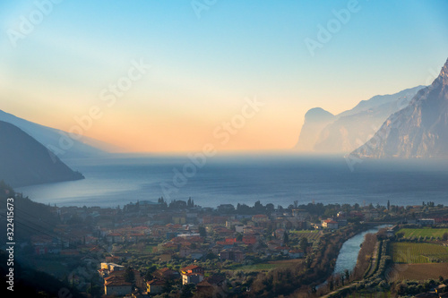 Italy, Trentino, Lake Garda, Riva del Garda at sunrise in Winter