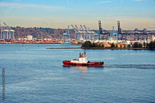Pleasure boats and yachts, seagoing vessels and tugboats on the roads of the port of Tacoma, USA. October, 2019.