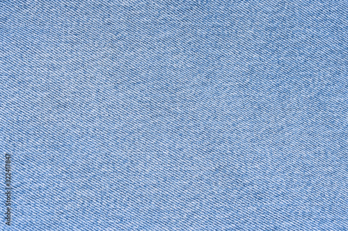 Blue denim texture background. Jeans fabric. Textured surface