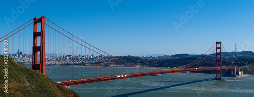 Full view of the Golden Gate Bridge on a clear day in the city by the bay ,skyline in background 